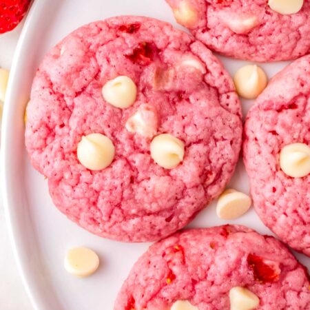 Strawberry White Chocolate Chip Cookies on a white serving plate.
