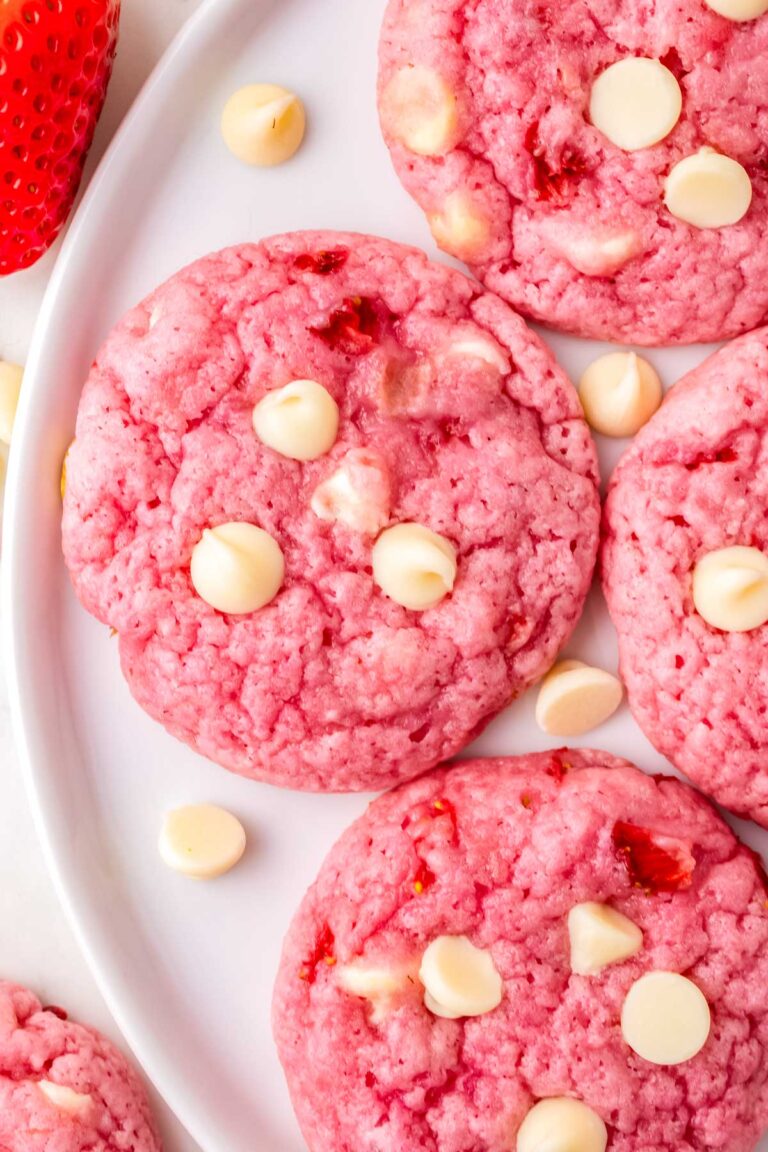 Strawberry White Chocolate Chip Cookies on a white serving plate.