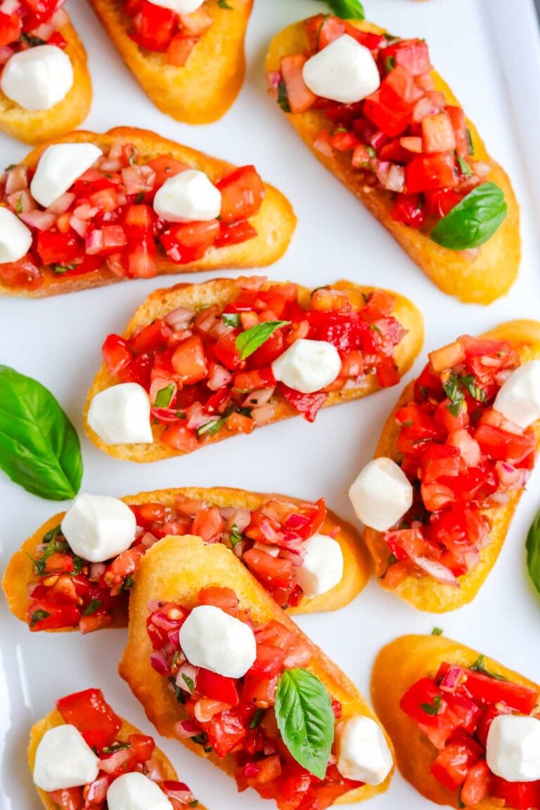 The finished Bruschetta with Mozzarella recipe on a white platter.