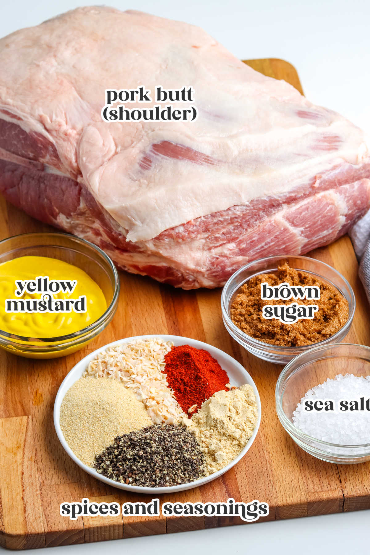 The smoked pulled pork recipe ingredients with text overlay labeling each ingredient.