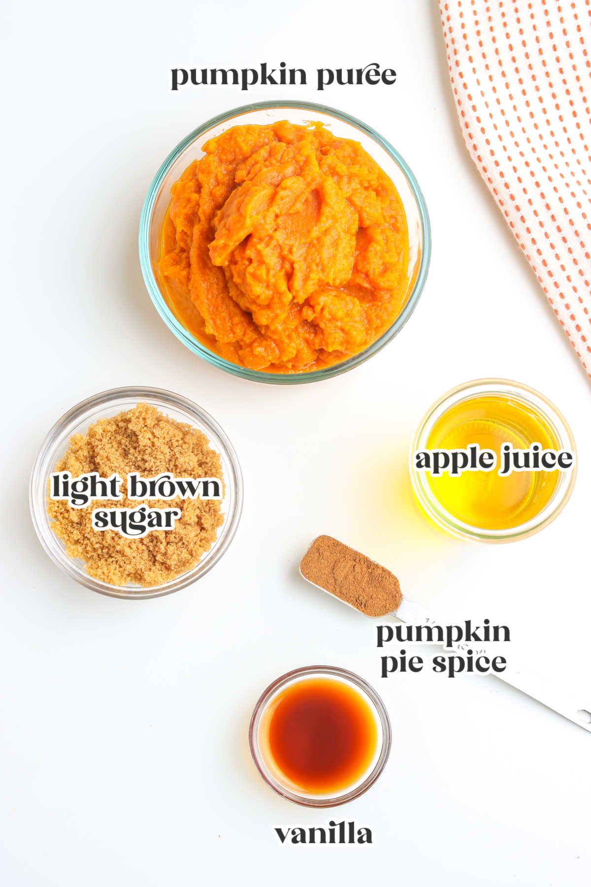 Recipe ingredients for homemade spiced pumpkin butter, including pumpkin puree, brown sugar, apple juice, pumpkin pie spice, and vanilla.