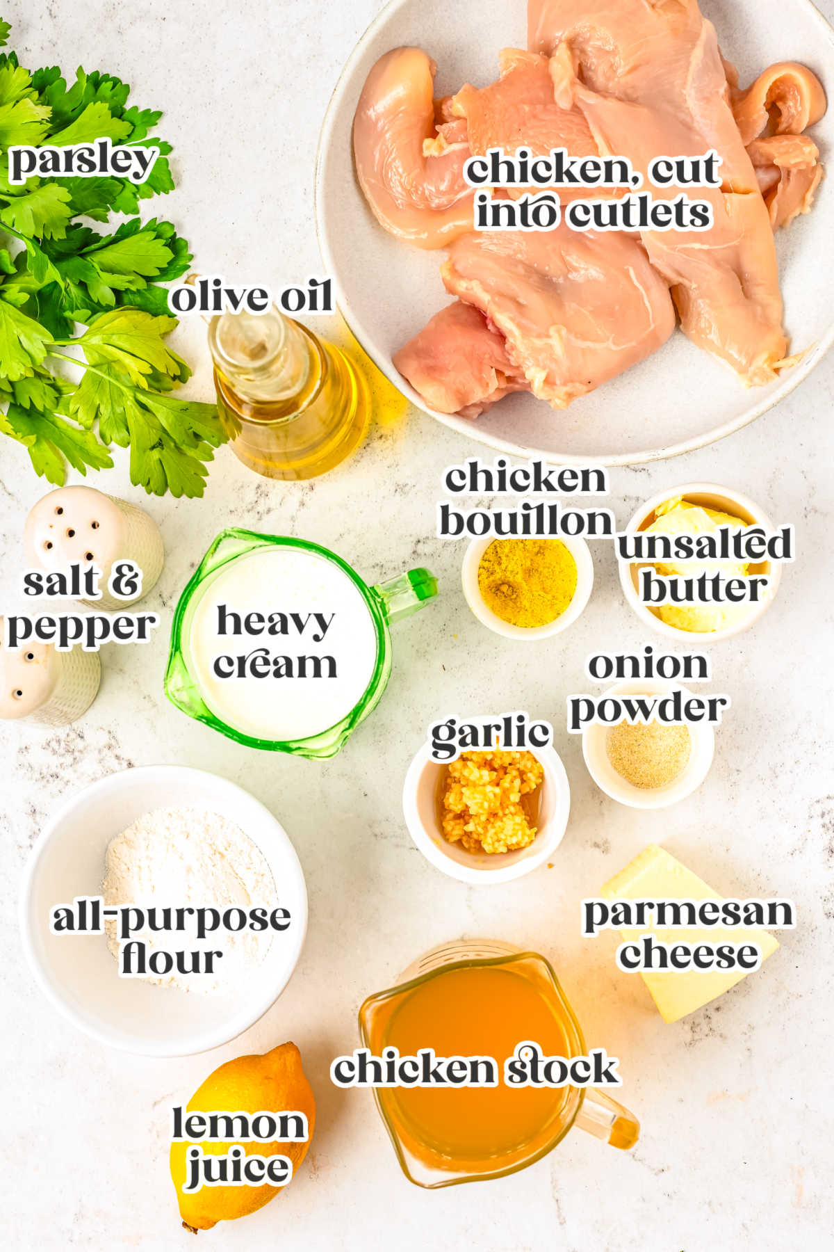Ingredients for creamy lemon chicken including chicken cutlets, heavy cream, lemon juice, parmesan cheese, garlic, chicken stock, flour, butter, olive oil, and parsley.