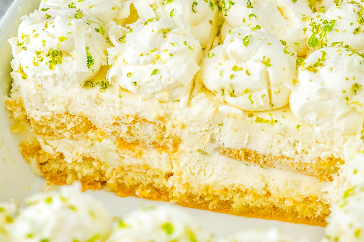 Close view of layered tiramisu with ladyfingers and lime cream.