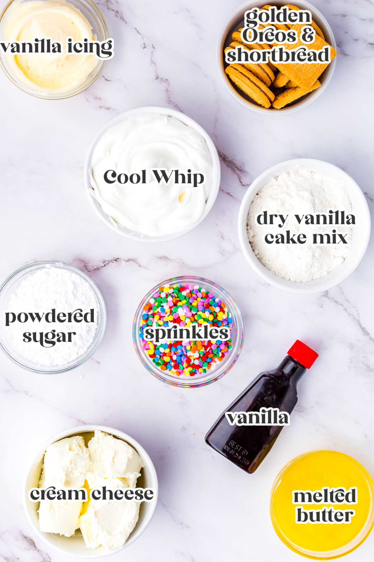ngredients for no bake funfetti cheesecake including golden sandwich cookies, shortbread cookies, cream cheese, whipped topping, vanilla cake mix, sprinkles, powdered sugar, butter, vanilla extract, and vanilla icing.